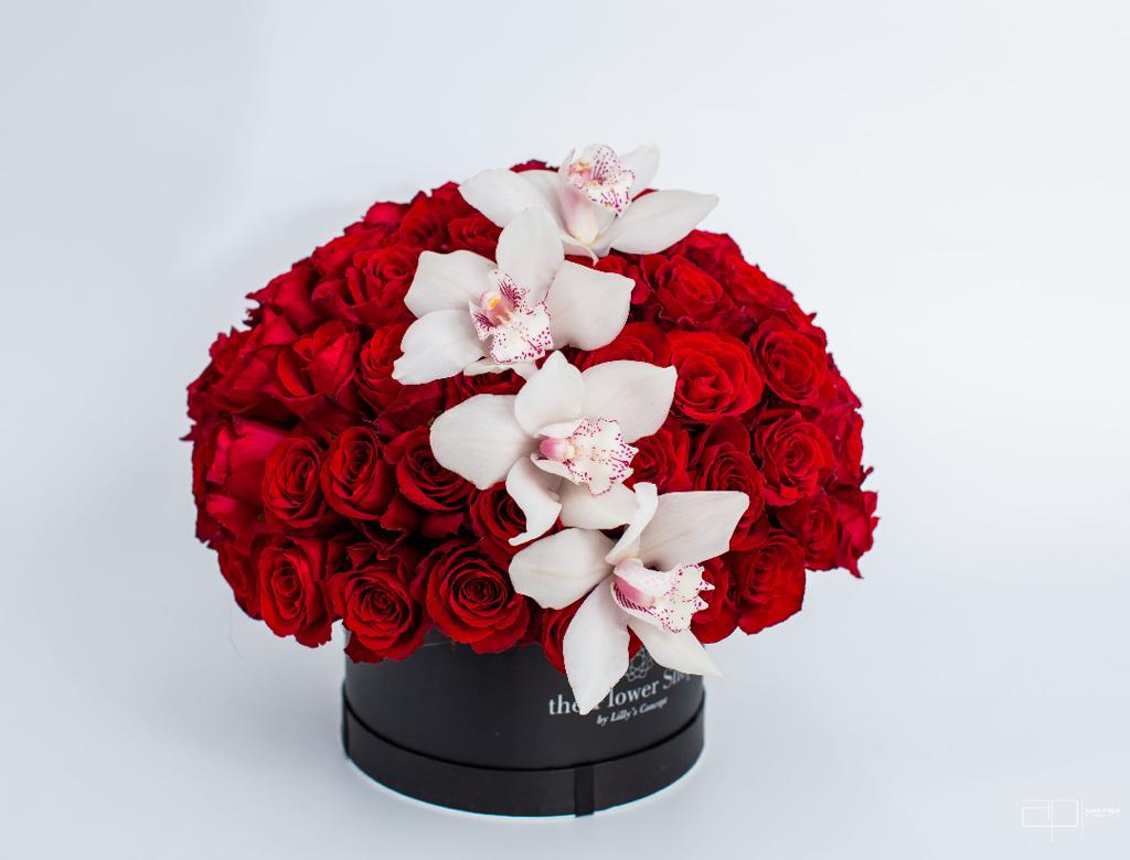 red roses with white orchids